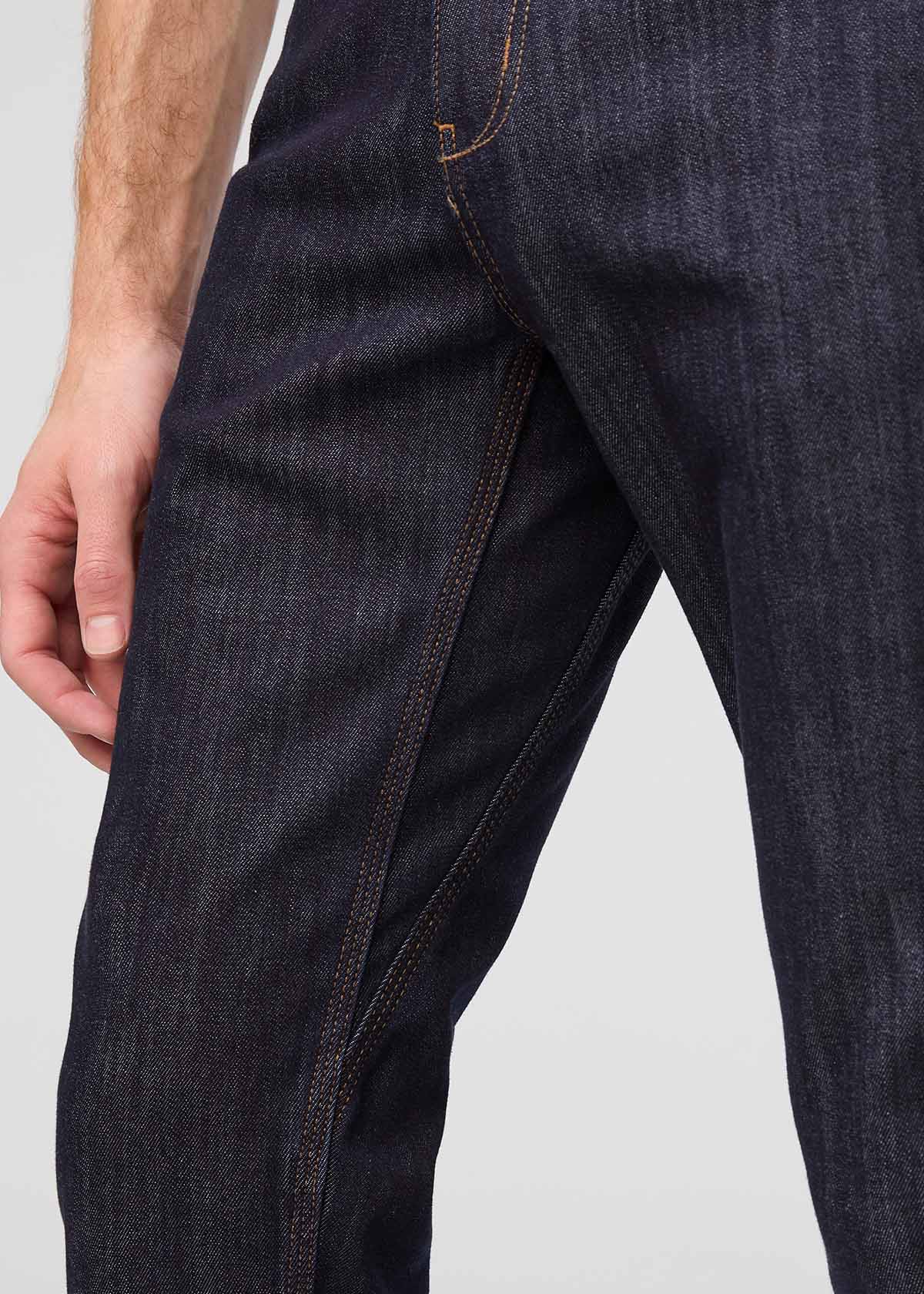 man wearing dark blue slim fit waterproof stretch jeans gusset