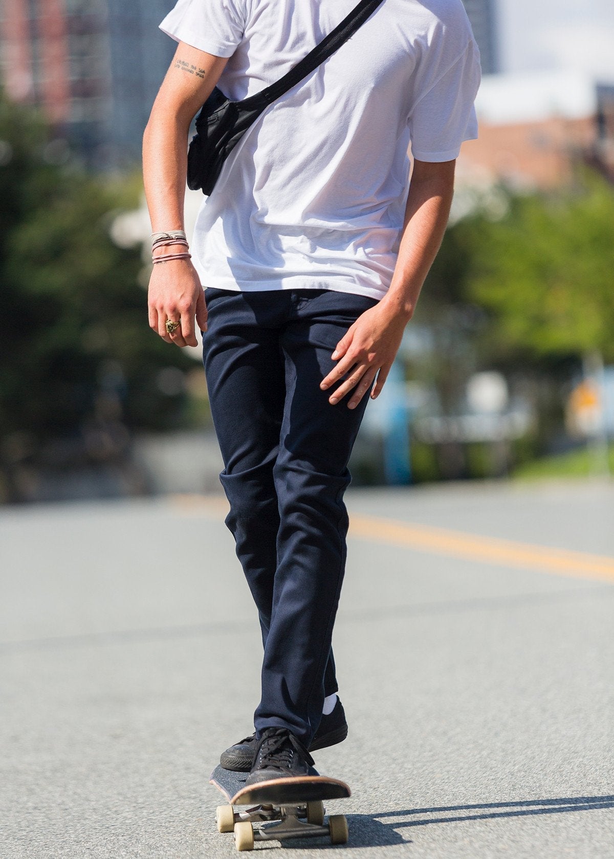 man skatebaording with slim fit dress sweatpant